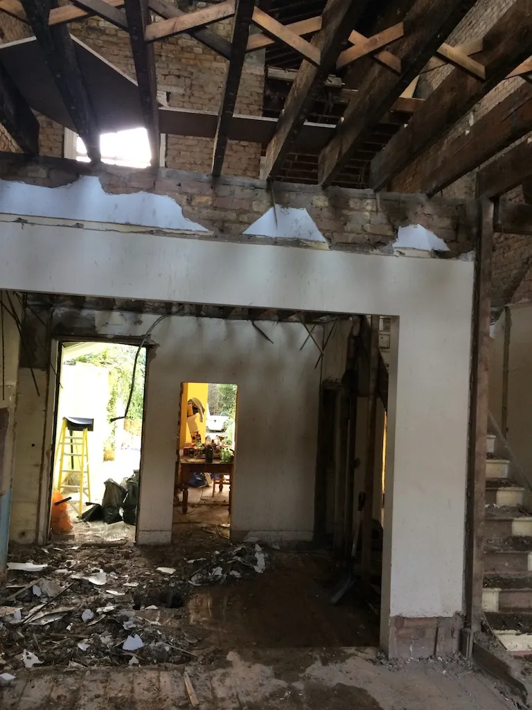 Ground floor stripped back to brick and joists during a house-to-flats conversion in Clapham