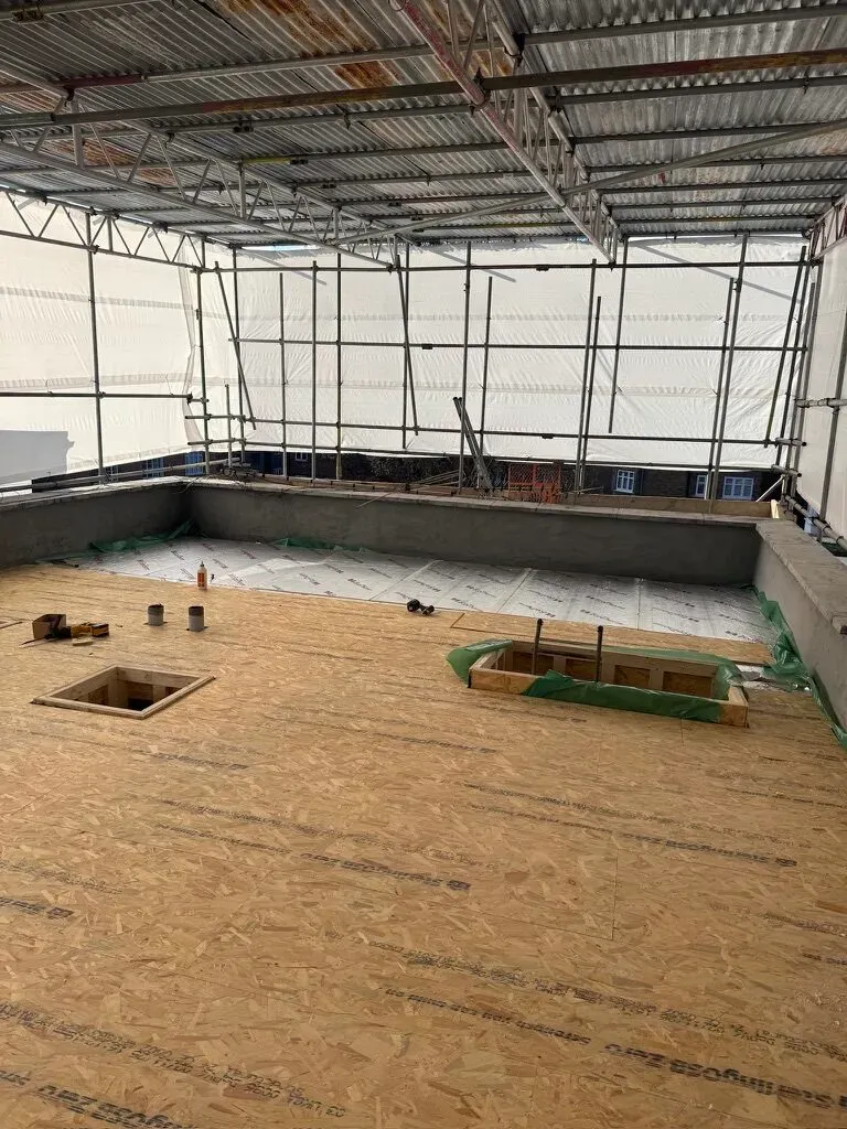 New insulated decking laid over the rebuilt and waterproofed roof terrace