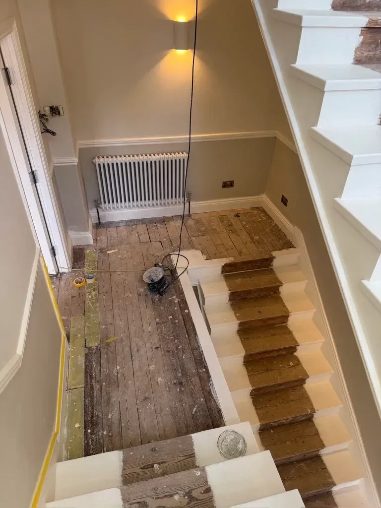 The original staircase mid-restoration during the Fulham period-house renovation