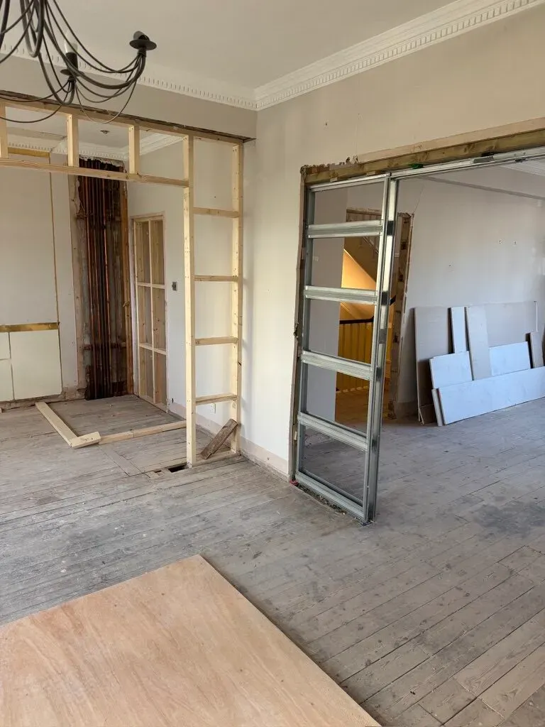 New stud walls and a steel door frame installed in the renovated period house