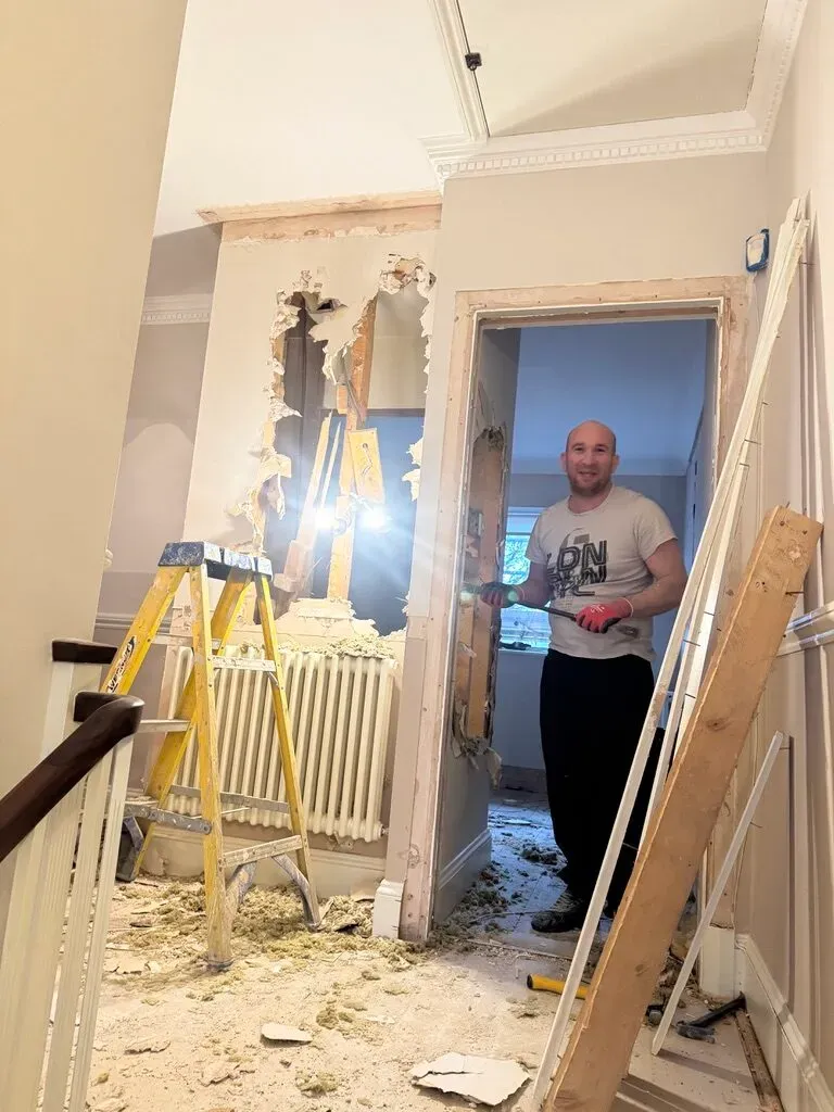 A structural opening being formed in a period wall during the Fulham renovation