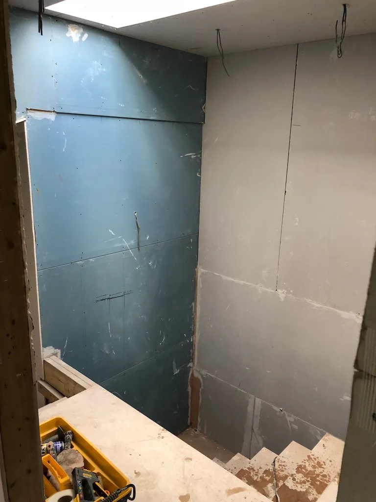 Moisture-resistant board fitted in the new loft bathroom and stairwell