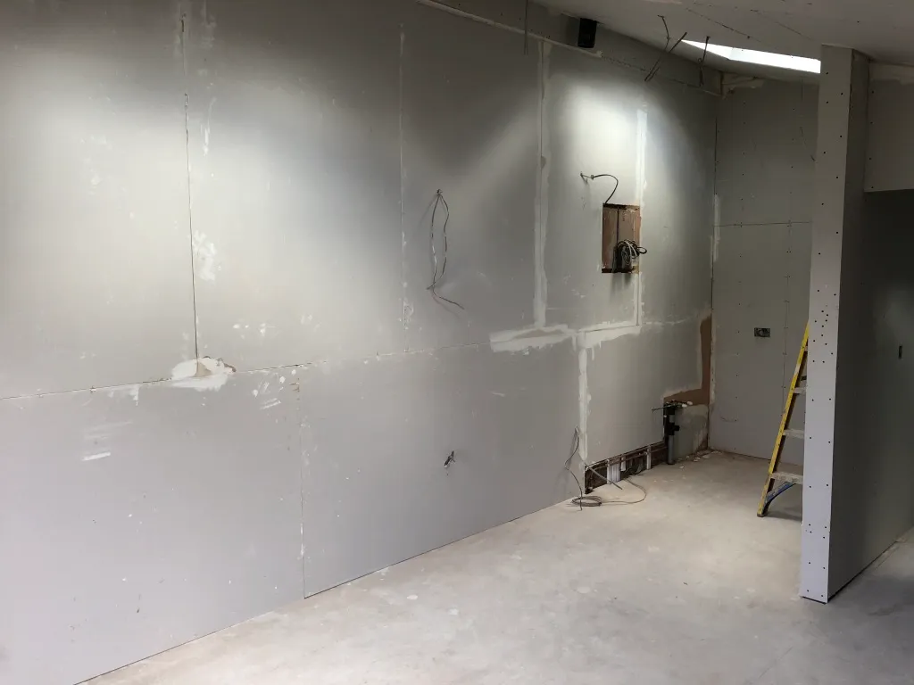 Plasterboarded loft bedroom awaiting plastering and second fix