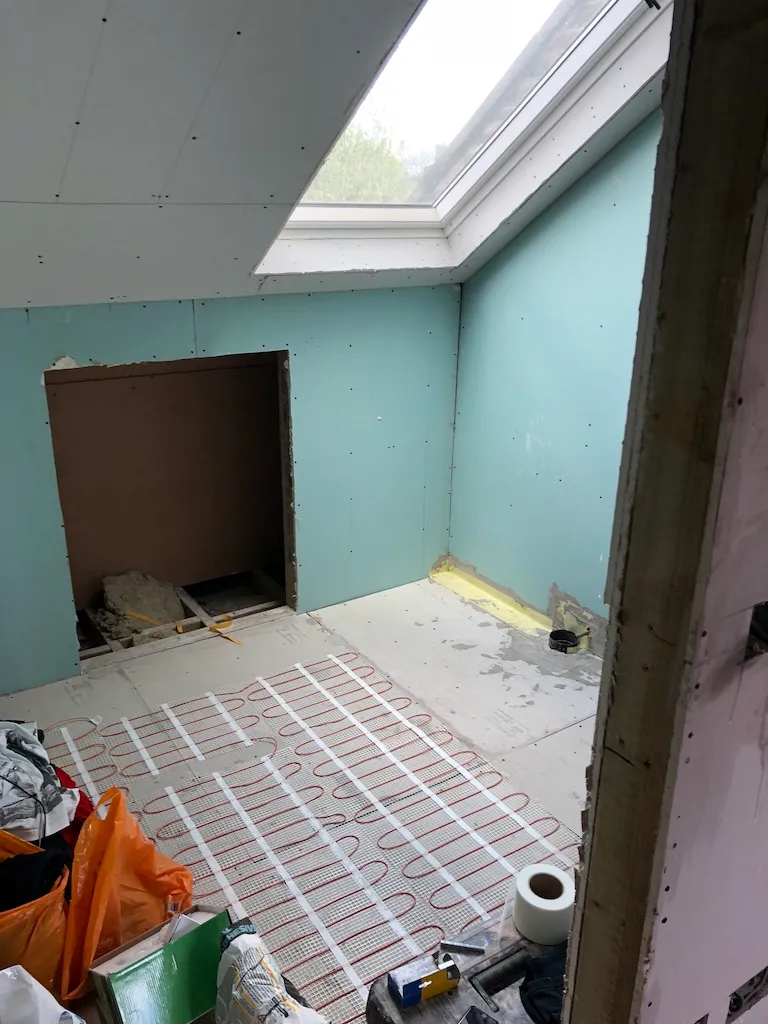 Underfloor heating pipes laid before screed during a loft conversion in Wandsworth