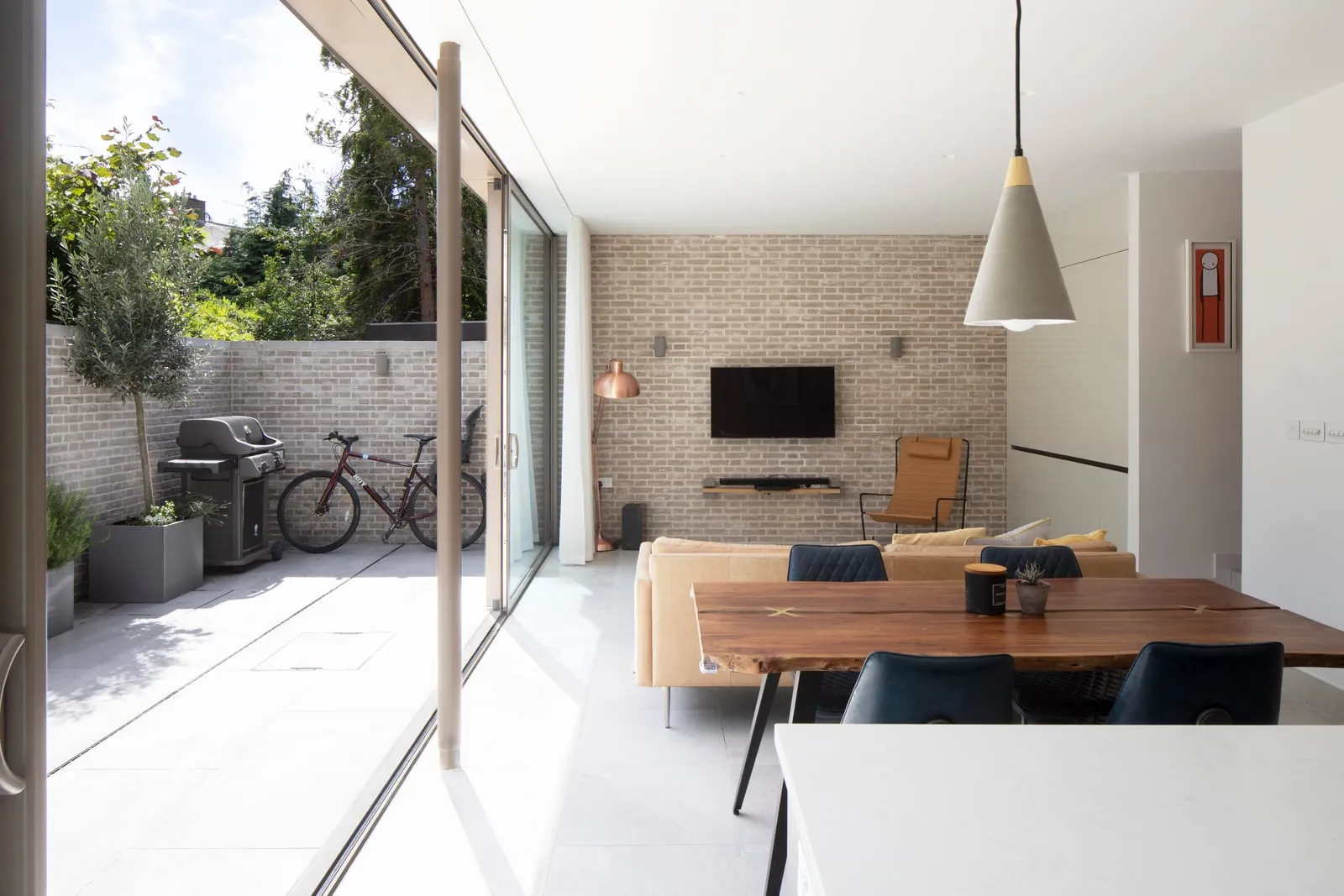 Living room with sofa and exposed brick feature wall