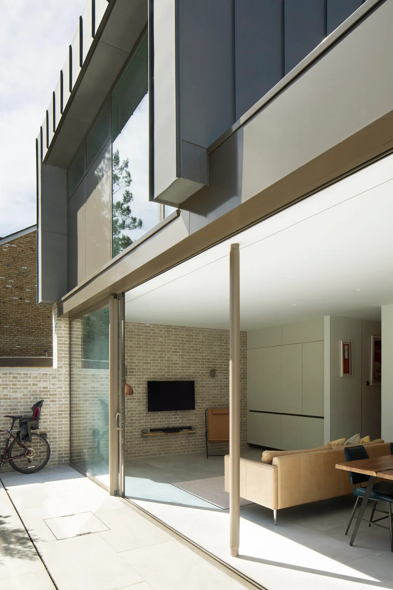 Completed upper-floor extension of the new-build house seen from the garden